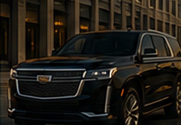 Chauffeured Cadillac Escalade outside an office building