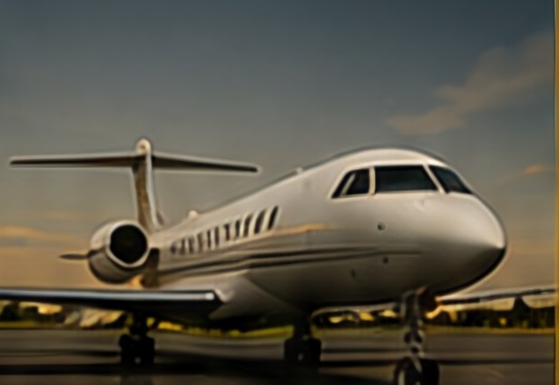 Private jet on the tarmac at sunset